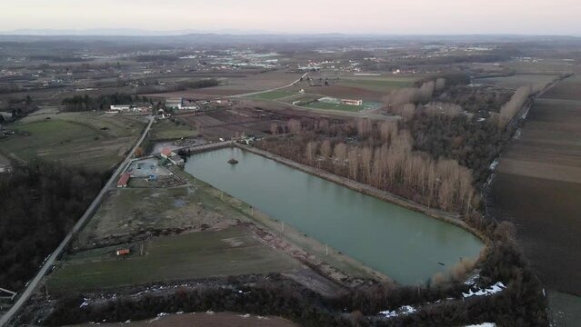 Lake in countryside in sunrise in Ub, Serbia drone view