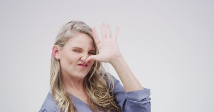 Crazy expression, portrait of woman studio with funny and positive attitude for meme, post or comedy. Goofy emoji, silly performance and face of happy person with comic facial on white background.