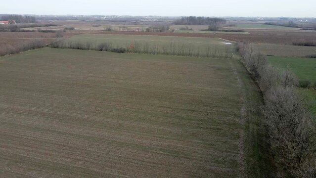 Agricultural fields with puddles in fog in Ub, Serbia