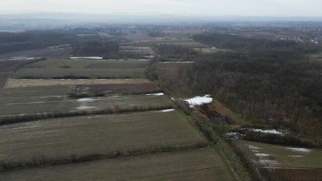Drone flies over flooded fields in gloomy weather in Ub, Serbia