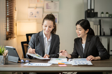 Asian businessmen, women and men Talk about new projects, presents at home office.