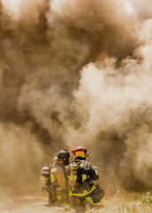 Firemen battle a house blaze that has consumed the entire building'