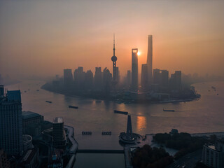 The drone aerial view of Lujiazui financial and trade zone at sunrise, Pudong, Shanghai, China.