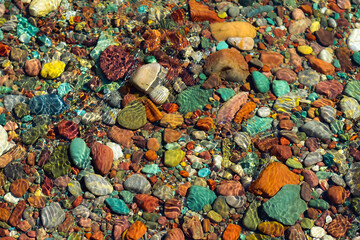 Colorful rocks photographed in an alpine lake in Montana 