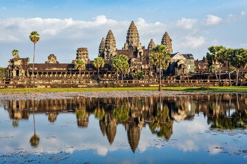 Naklejka premium Famous Cambodian landmark and tourist attraction Angkor Wat with reflection in water. Cambodia, Siem Reap