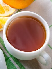 Cup of tea served with orange jam