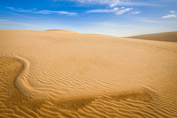 White sand dunes desert on sunrise, Mui Ne, Vietnam