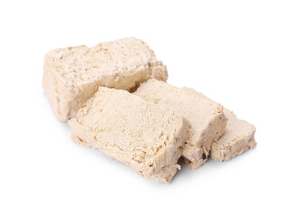 Pieces of tasty halva isolated on white