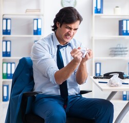 Businessman rejecting new ideas with lots of papers