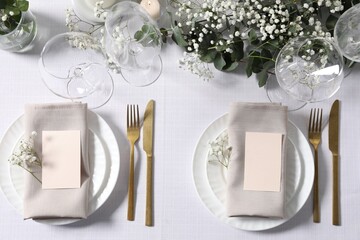Beautiful table setting with floral decor, flat lay