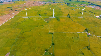 Panoramic view of wind farm or wind park, with high wind turbines for generation electricity with...