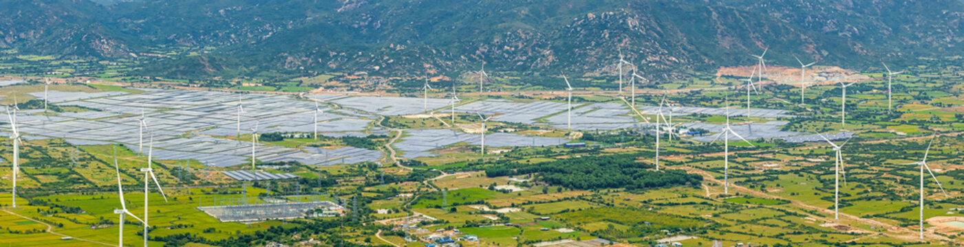 Wind Turbines And Solar Panels At Sunset - Renewable Energy Concept. Ninh Thuan, Vietnam