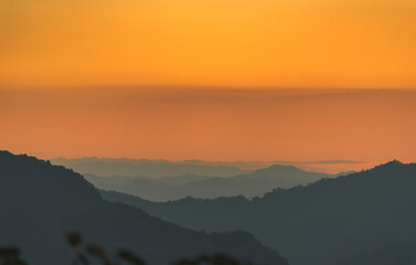 Fototapeta premium Scenic view dramatic beautiful sunset sky. Natural Sunset Sunrise on meadow silhouette shadow dark land. Vibrant dramatic sky on sunset, dawn, sunrise in Countryside. Landscape Colorful Sky At Sunset