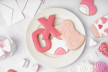 Composition with sweet cookies, marshmallows and envelopes on light background. Valentine's Day...