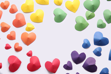 Frame made of colorful paper hearts on white background. LGBT concept