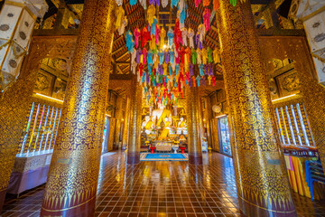 Fototapeta na wymiar Beautiful Wat Buddhist temples in Chiangmai Chiang mai Thailand. Decorated in beautiful ornate colours of red and Gold and Blue. Lovely sunset