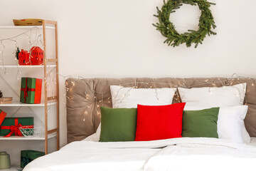 Big bed with Christmas lights in bedroom