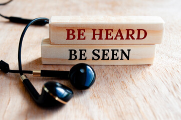 Be heard and be seen text on wooden blocks. Business concept
