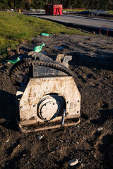 Closeup of a heavy equipment attachment on a new residential community construction site
