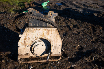 Closeup of a heavy equipment attachment on a new residential community construction site
