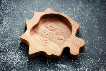The children's plate in the shape of a cartoon character is made of wood for serving snacks, fruits, nuts, cheeses, meat and original serving of main dishes. Accessories for a modern kitchen.
