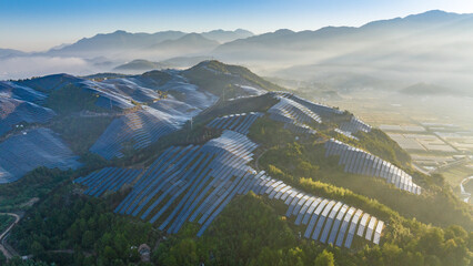 Aerial photography of solar photovoltaic panels on the mountain