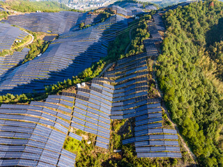 Aerial photography of solar photovoltaic panels on the mountain