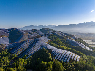 Aerial photography of solar photovoltaic panels on the mountain