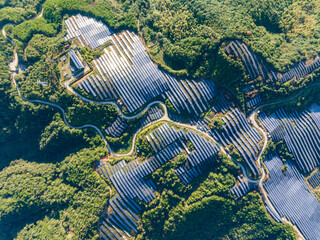 Aerial photography of solar photovoltaic panels on the mountain