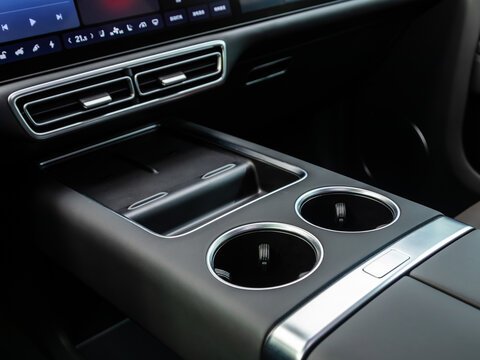 Novosibirsk, Russia - December 01 , 2023:        LI L9,  close-up of seat heating buttons, cup holders. modern car interior: parts, buttons, knobs.
