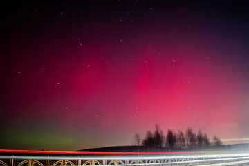  The Northern Lights are red. Rethinking the northern Lights using other colors. A rare image of the red Aurora borealis (Northern Lights). Selective focus. © Nikita
