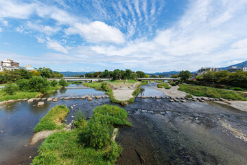 Fototapeta premium A delta of Kamo river with old stepping stones in Kyoto, Japan