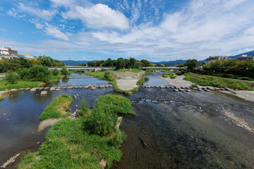 Fototapeta na wymiar A delta of Kamo river with old stepping stones in Kyoto, Japan