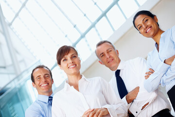 Fototapeta premium Portrait, collaboration and business people with teamwork, cooperation and mentor with coaching, corporate training and professional. Face, group and manager with employees, smile and partnership