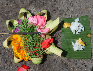 Balinese Canang Sari offerings to the Gods on a beach in Bali