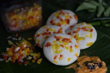 Savory bell pepper idly served on plantain leaf