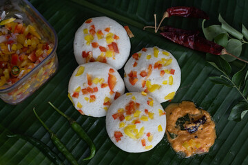 Savory bell pepper idly served on plantain leaf