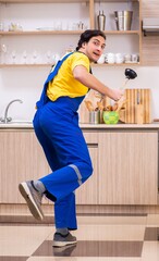 Young male contractor repairing tap at home