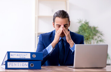 Young male accountant working in the office