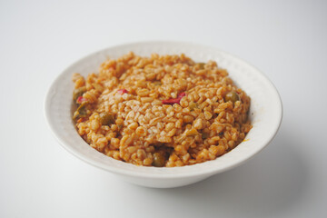 bulgur rice with tomato on a plate ,