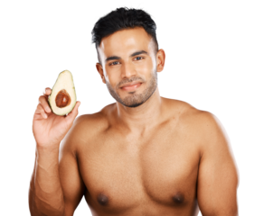 Avocado, healthy beauty and portrait of man for vitamin c nutrition, natural cosmetics and detox isolated on a transparent png background. Indian guy, sustainable skincare and fruit for dermatology