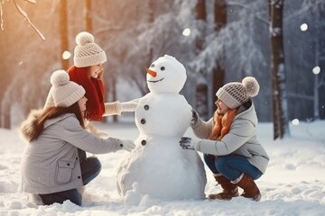 Fototapeta na wymiar Happy father, mother and kids gathering in snow-covered park together sculpting funny snowman from snow. Parents and children playing outdoor in winter forest. Family active holiday comeliness