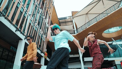 Caucasian group practice break dancing together. Energetic street dancer team in stylish fashion...