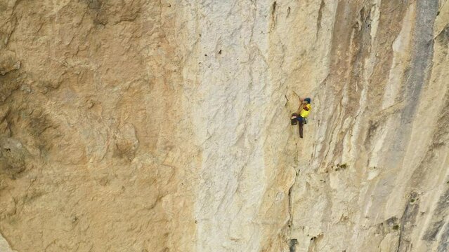 The Great Ascent: Conquering the Majestic Cliff Face with Determination and Courage