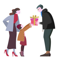 お父さんにプレゼントを渡す冬服の家族