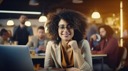Attractive African Businesswoman Seated at Office Table - A Portrait of Determined Success.