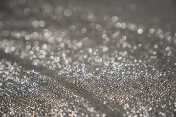 Shiny and sparkling glitter silver clothing close up of new design. 
