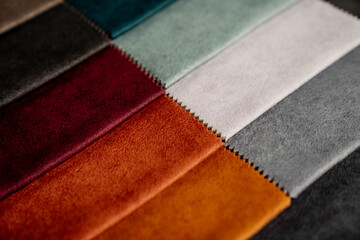 Different kind and colours fabrics next to each other of cloth