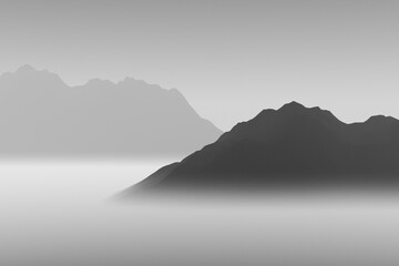 Silhouettes of high mountains in thick fog.