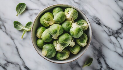 Top view of a brussels sprouts in a solid white marble background; copy space